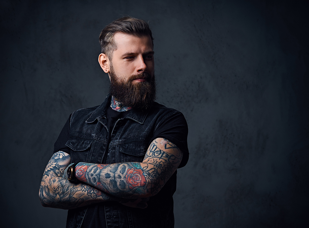 studio-portrait-of-bearded-hipster-male-with-tatto-MQVXECP.jpg